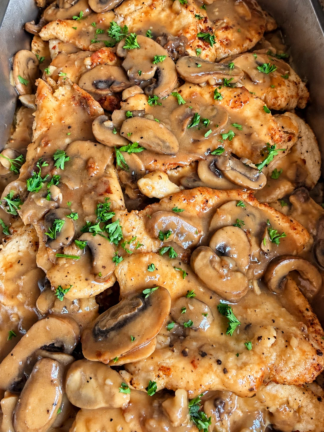 Avenue29 chicken Marsala with mushrooms, sauce, and fresh herbs