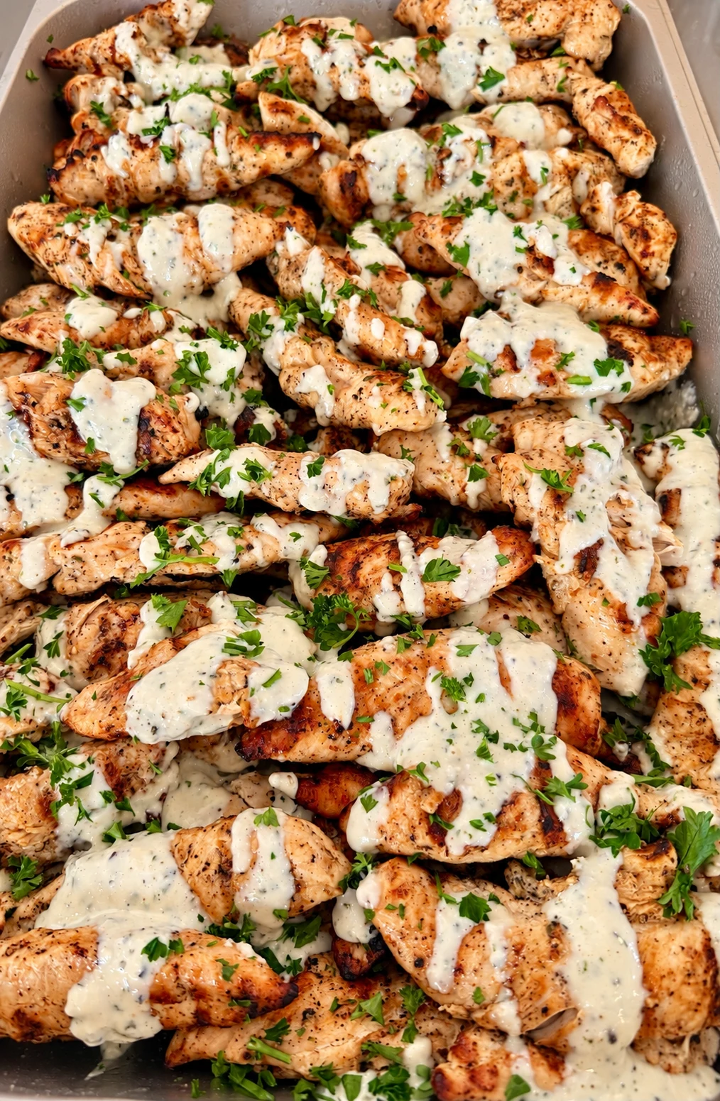 Avenue29 grilled chicken finished with a creamy house-made sauce and herbs